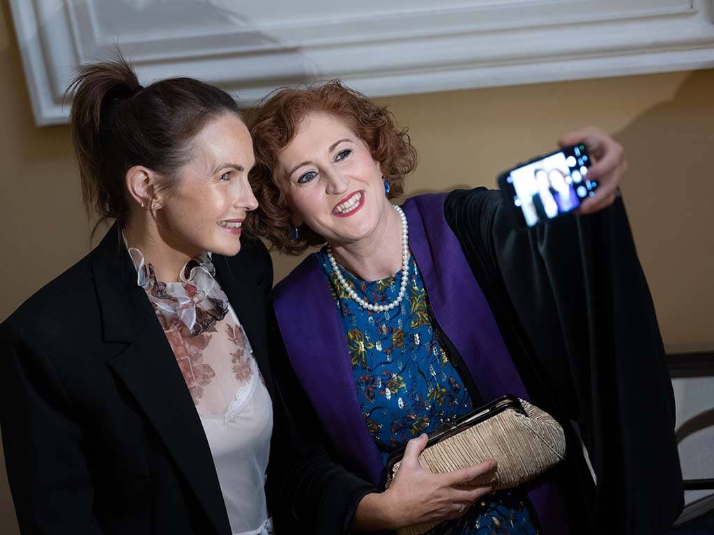 Newly conferred Fellow takes a selfie with guest